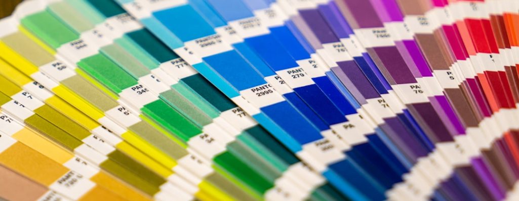 A close-up of a fan of color swatches used for printing.
