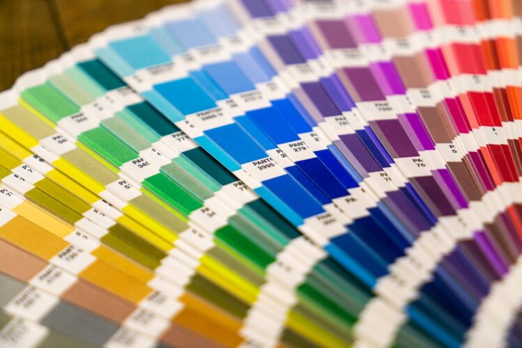 A close-up of a fan of color swatches used for printing.